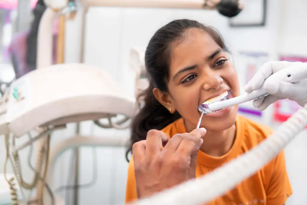 endodontist-checking-the-teeth-of-a-woman