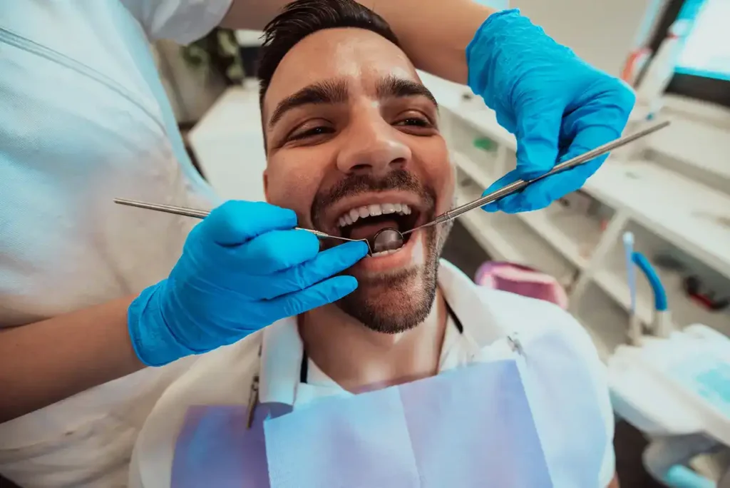 a-dentist-checking-a-patient's-teeth